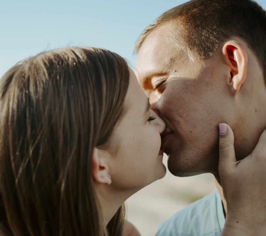 kisses at Devil's backbone during engagement photos