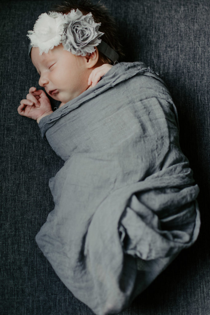 Newborn in Gray blanket in Loveland 