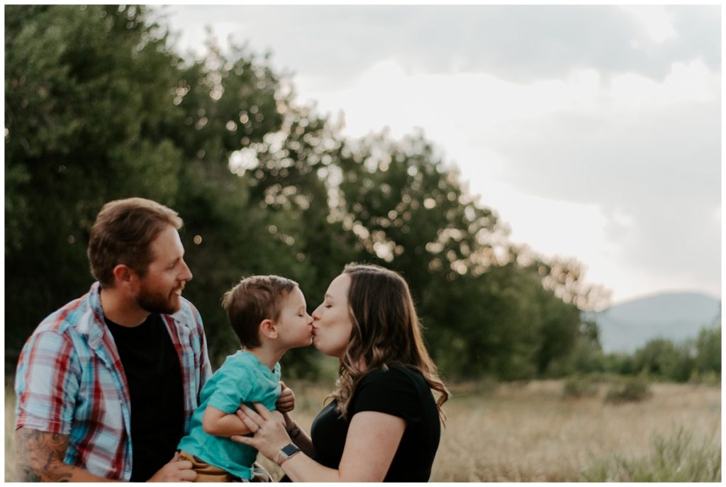 Mom kisses son during family photos in Northern Colorado
