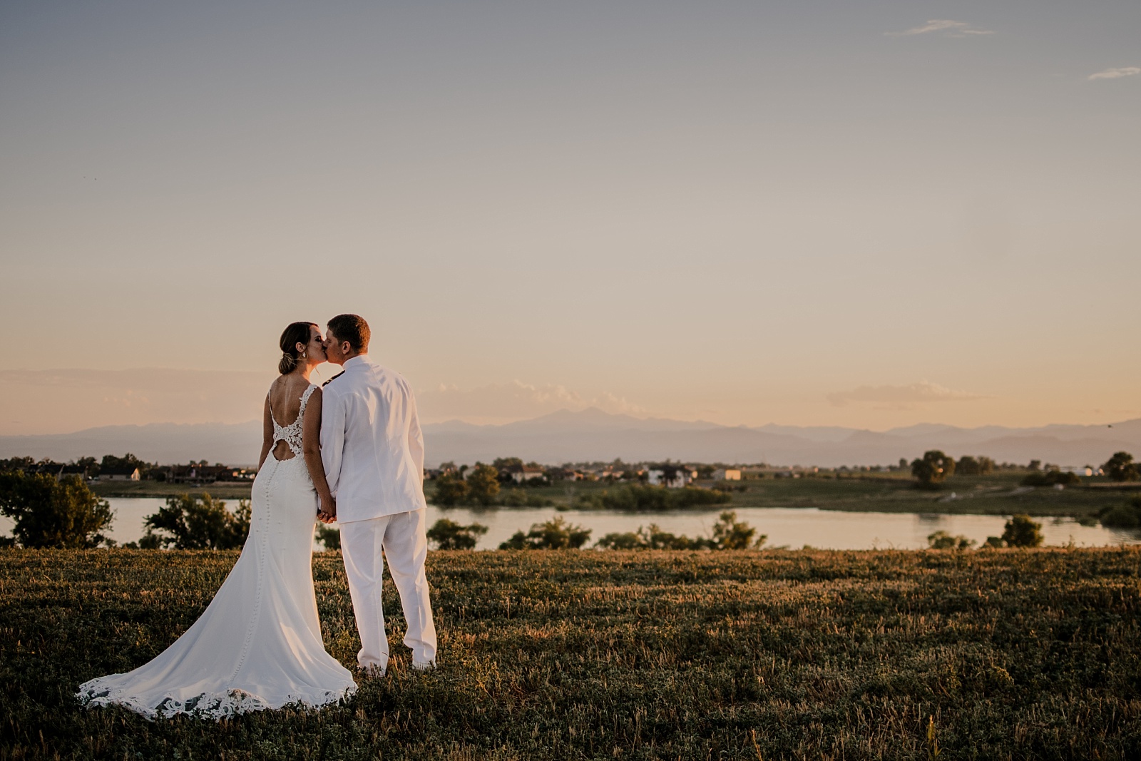 Sunset kisses at a backyard wedding in Colorado