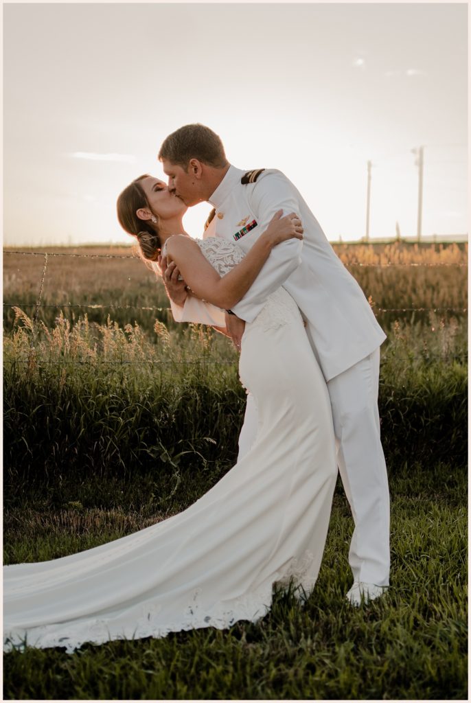 Bride and groom kiss at sunset at their backyard wedding in Fort Collins, Colorado
