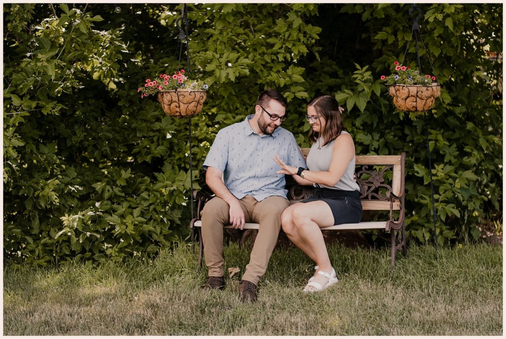Couple sits together on a bench at the Lyons Farmette