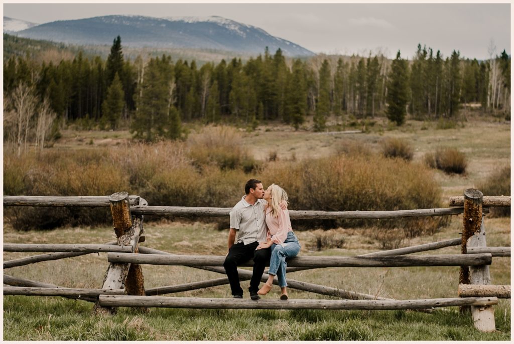 Couple kisses during their Colorado mountain engagement photos