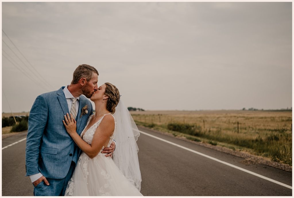 Couple kisses at outdoor wedding in Colorado