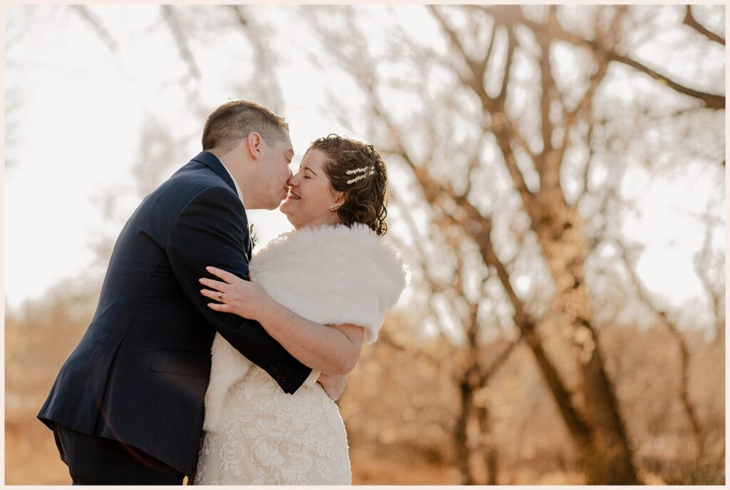 Couple leans in for a kiss at Sweetheart Winery wedding 